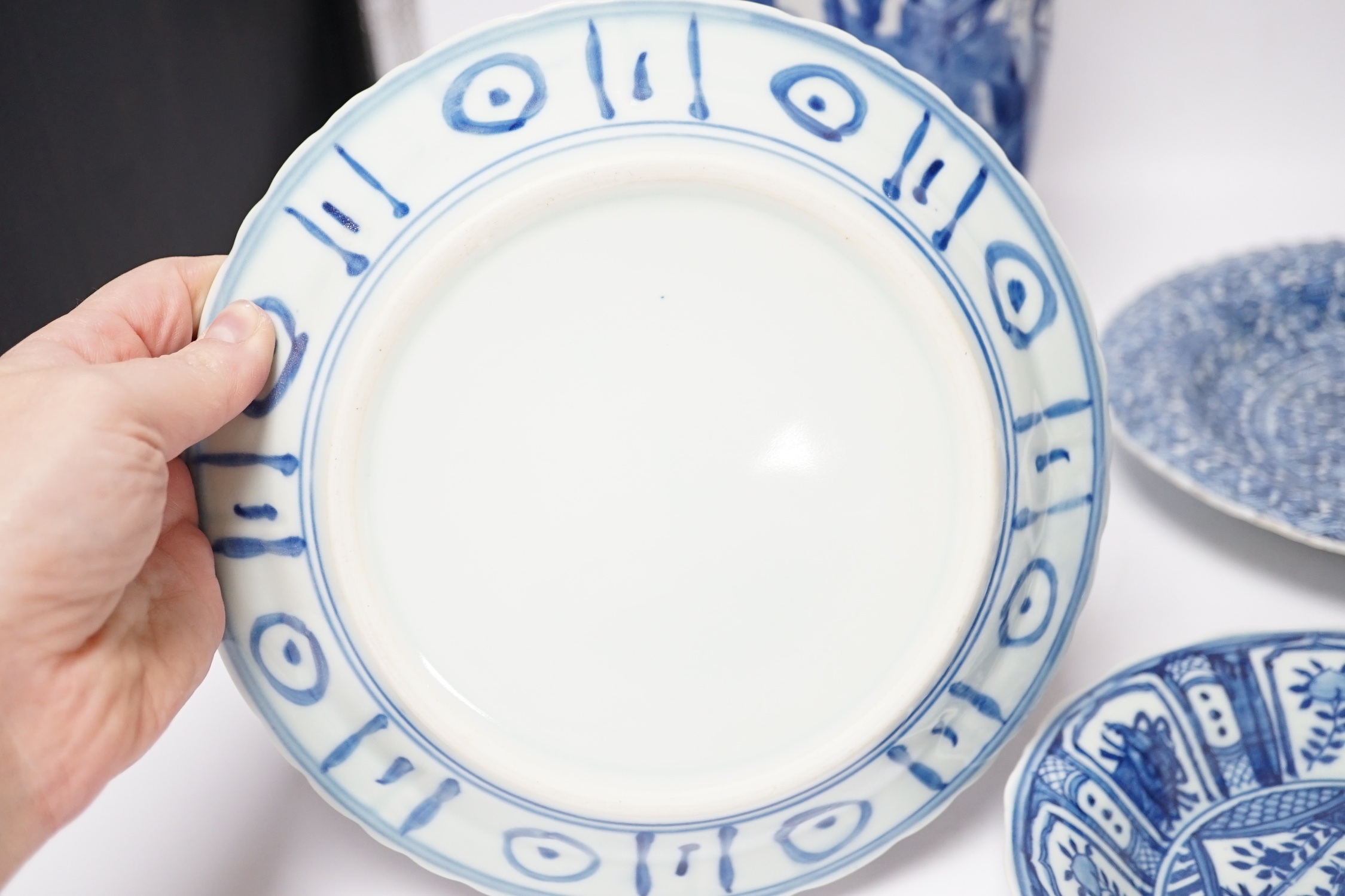 A group of Chinese blue and white dishes and plates and a damaged vase, 30cm